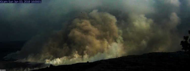 Click to enlarge An ash plume rises from Halemaumau Crater
