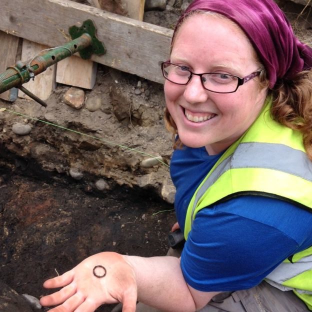 Cathy MacIver ,of AOC Archaeology, with a bronze ring from the excavations.