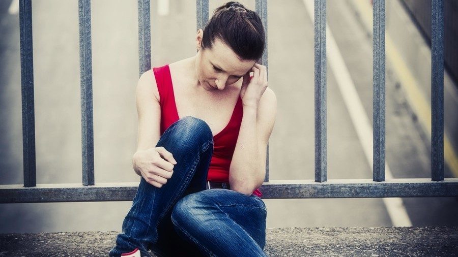 sad woman on bridge