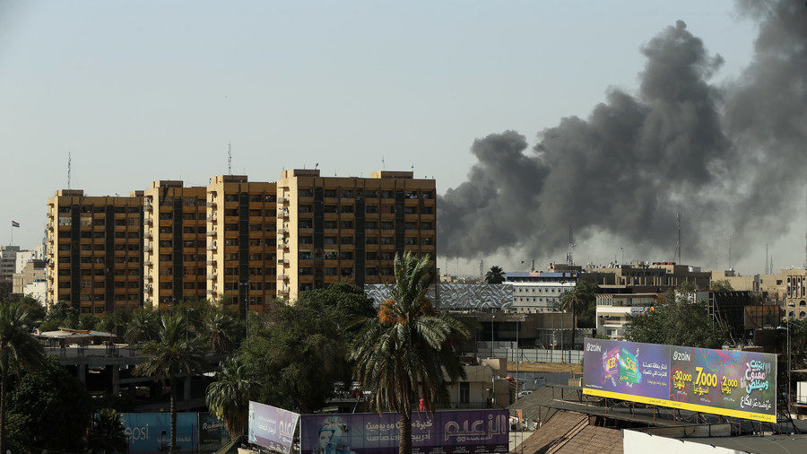Dark plumes rise into the air above Baghdad