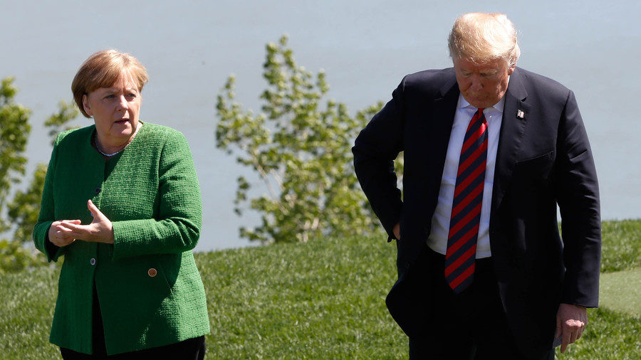 Germany's Chancellor Angela Merkel talks with US President Donald Trump at the G7 summit