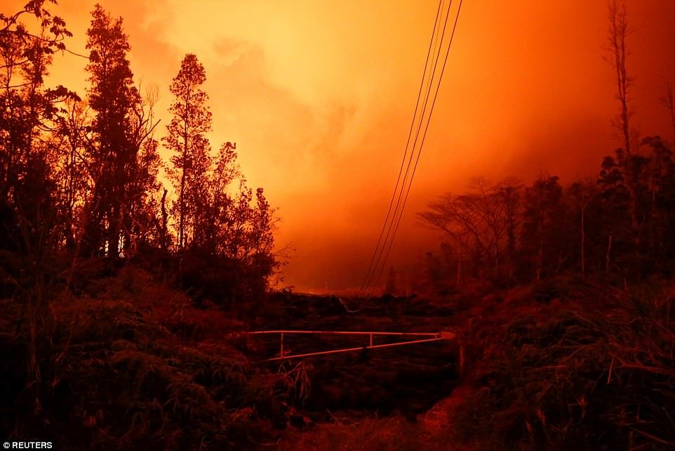 Click to enlarge Lava from the Kilauea volcano- orange sky