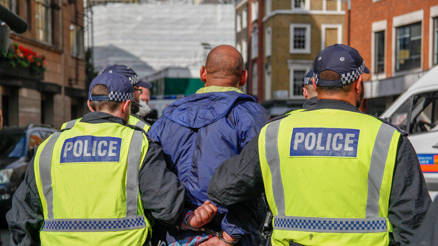 Police arrest a counter-demonstrator at Sunday's Al Quds march