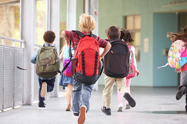 children with backpacks