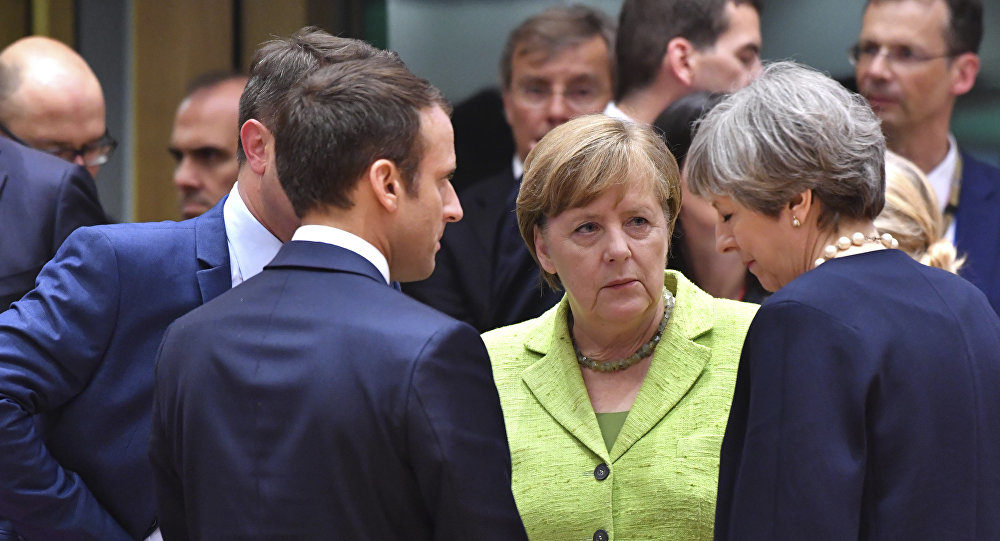 Click to enlarge French President Emmanuel Macron, German Chancellor Angela Merkel and an Chancellor Angela Merkel, and British Prime Minister Theresa May
