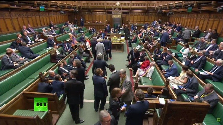 MPs voting in House of Commons