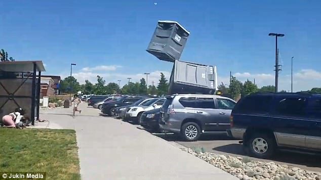 Click to enlarge People were forced to dive for cover after a huge blast of wind whipped through a park in Commerce City, Colorado