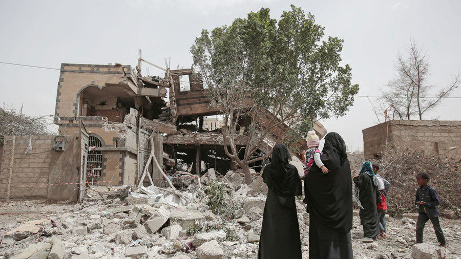 Yemeni women inspect a destroyed house after it was hit by Saudi-led airstrikes in Sanaa, Yemen, 06 June 2018