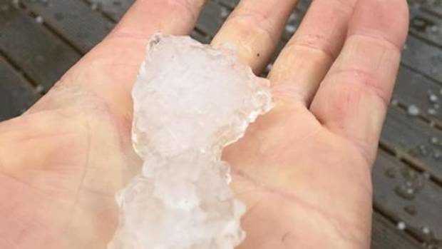 Click to enlarge Large hail stones left 20 holes in Gregg Simpson's veranda roofing.