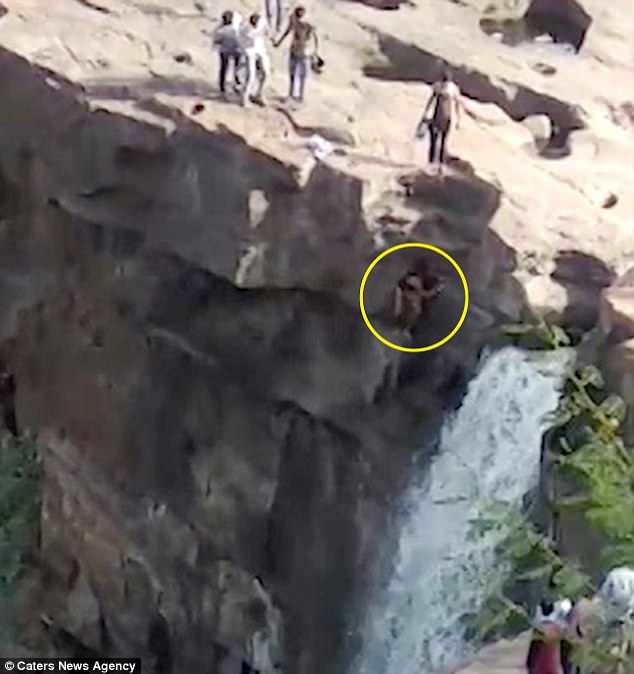 For the likes:  Video shows Ramjan Usman Kagji, 35, climbing off the edge of the famous Gokak waterfalls in the Belagavi district of Karnataka state, southern India