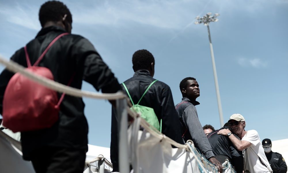 Click to enlarge Migrants disembark the Aquarius in Valencia
