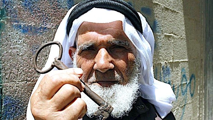 Palestinian man w key