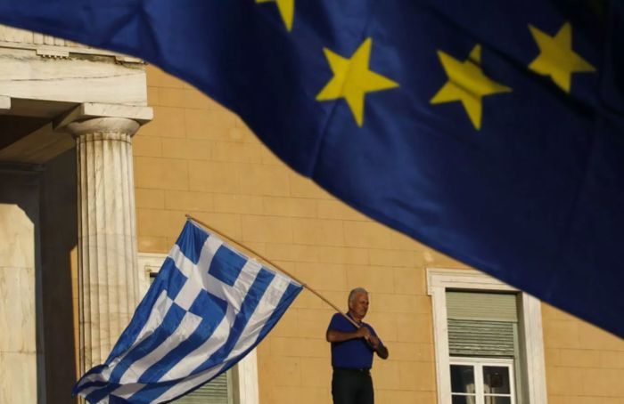 Click to enlarge EU/Greece flag guy