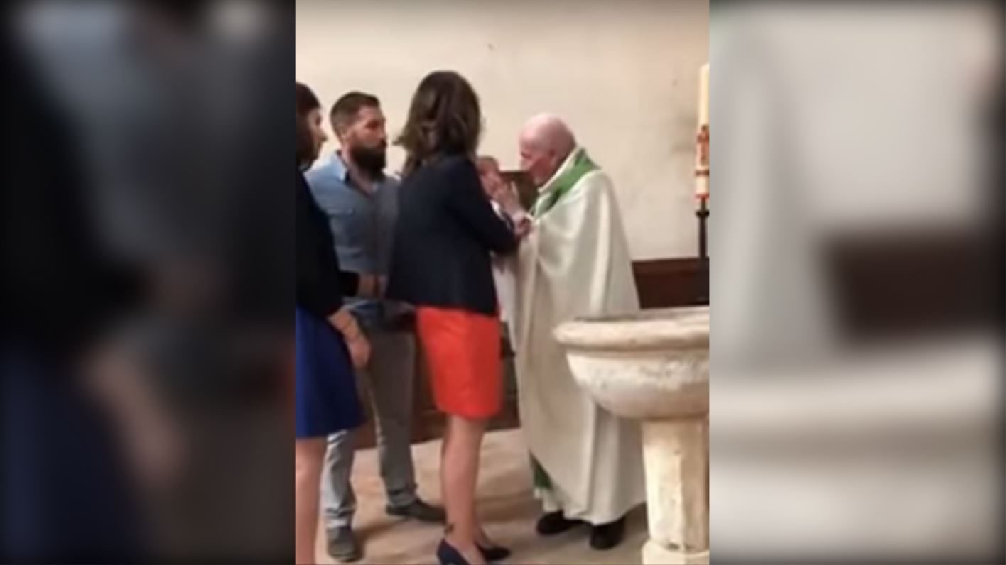 Click to enlarge French priest slaps baby during baptism