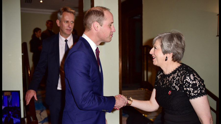 Prime Minister May bows to Prince William at last year's Pride of Britain awards