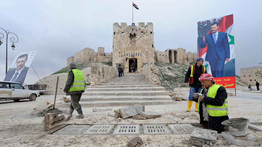 Click to enlarge Workers repair the damage in front of Aleppo's historic citadel on January 31, 2017