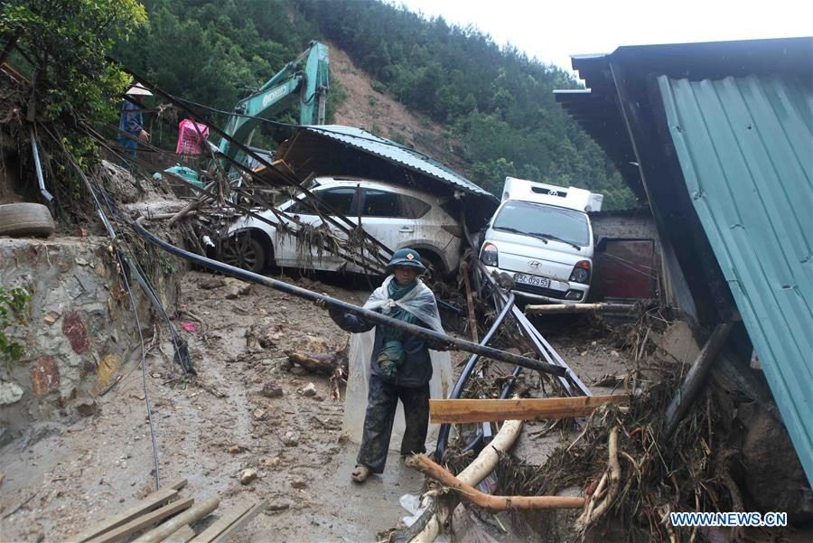Rescuers work at the flood-affected area in Lai Chau province, north of Vietnam, on June 25, 2018
