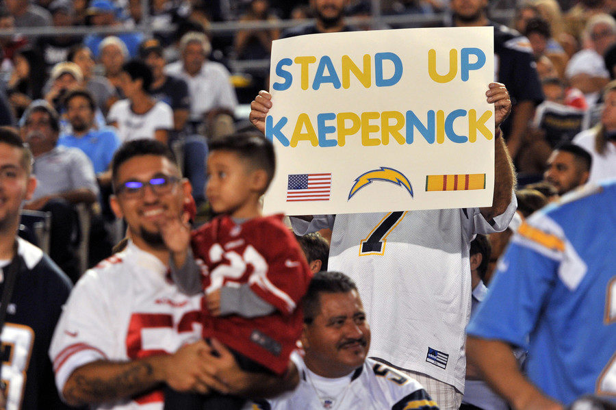 Click to enlarge Kaepernick takes a knee