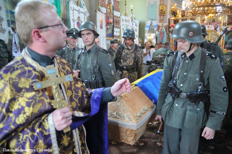 Click to enlarge A Uniate priest blessing Neo-Nazis in Ukraine. Note: Uniates are part of the Catholic Church, they do not claim to be Orthodox