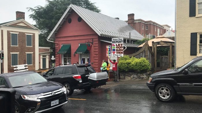 Click to enlarge Red Hen protester