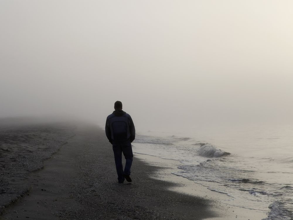 man walking on beach