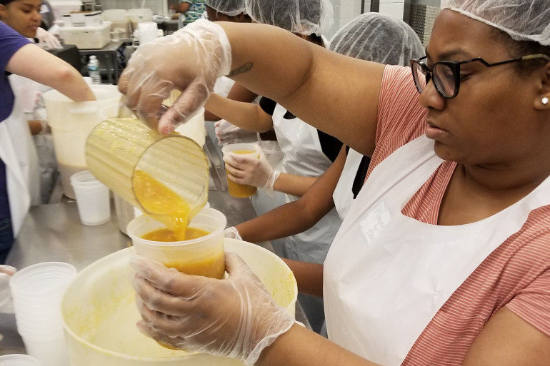 Click to enlarge volunteer at MANNA