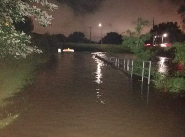 Click to enlarge Heavy rainfall caused the Jordan Creek in West Des Moines to spill over its banks.