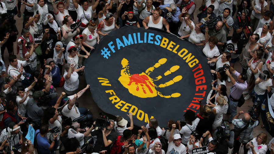 Immigration activists rally inside the Hart Senate Office Building