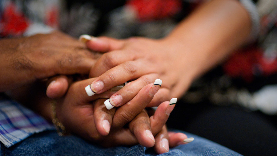 Click to enlarge man and woman holding hands