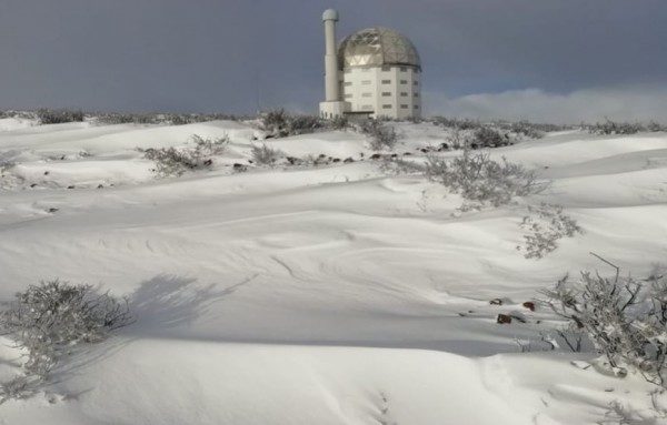 Click to enlarge The SALT Observatory in Sutherland is surrounded by snow.