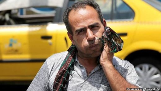 Iranian man dealing with heatwave