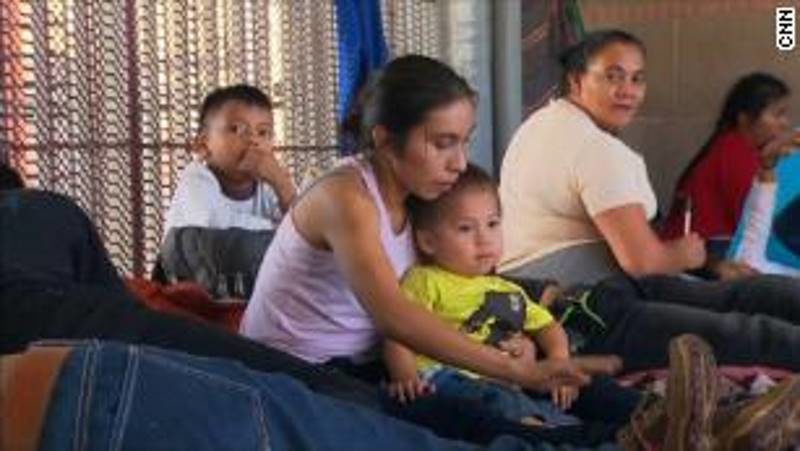 Click to enlarge migrant family asylum