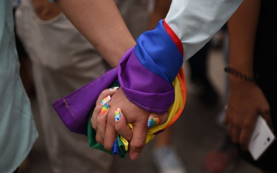 Women holding hands