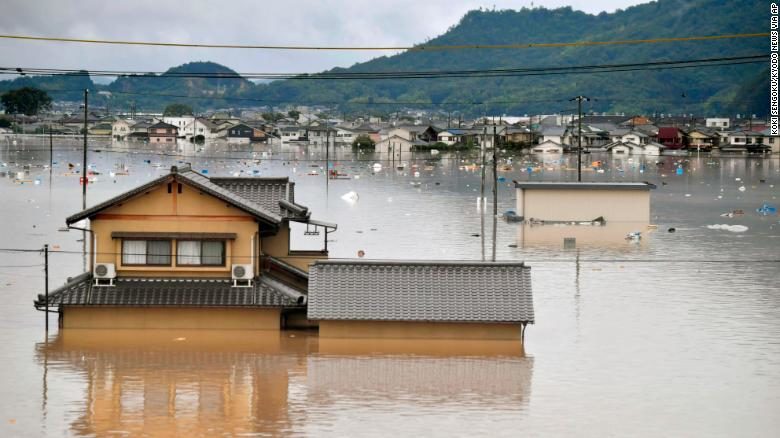 Click to enlarge Residential buildings are partially submerged in floodwaters caused by heavy rains in Kurashiki, Okayama prefecture, southwestern Japan, Saturday, July 7, 2018.