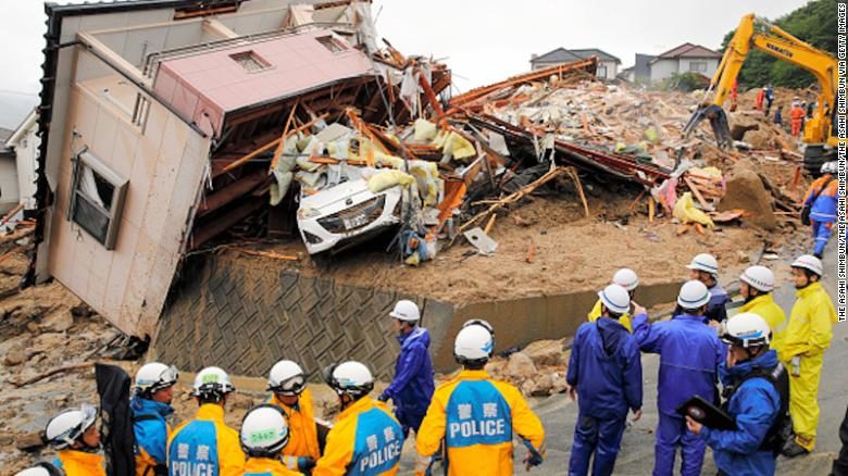 Click to enlarge Rescue operations continue at a collapsed house on July 8, 2018 in Kumano, Hiroshima, Japan.