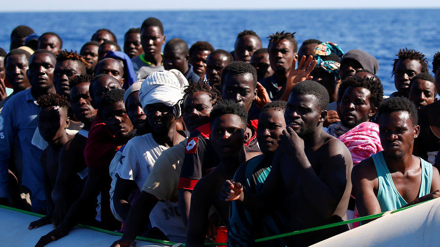 Click to enlarge migrants on a boat
