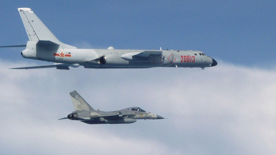 Taiwanese jet fighter jet next to Chinese H-6 bomber