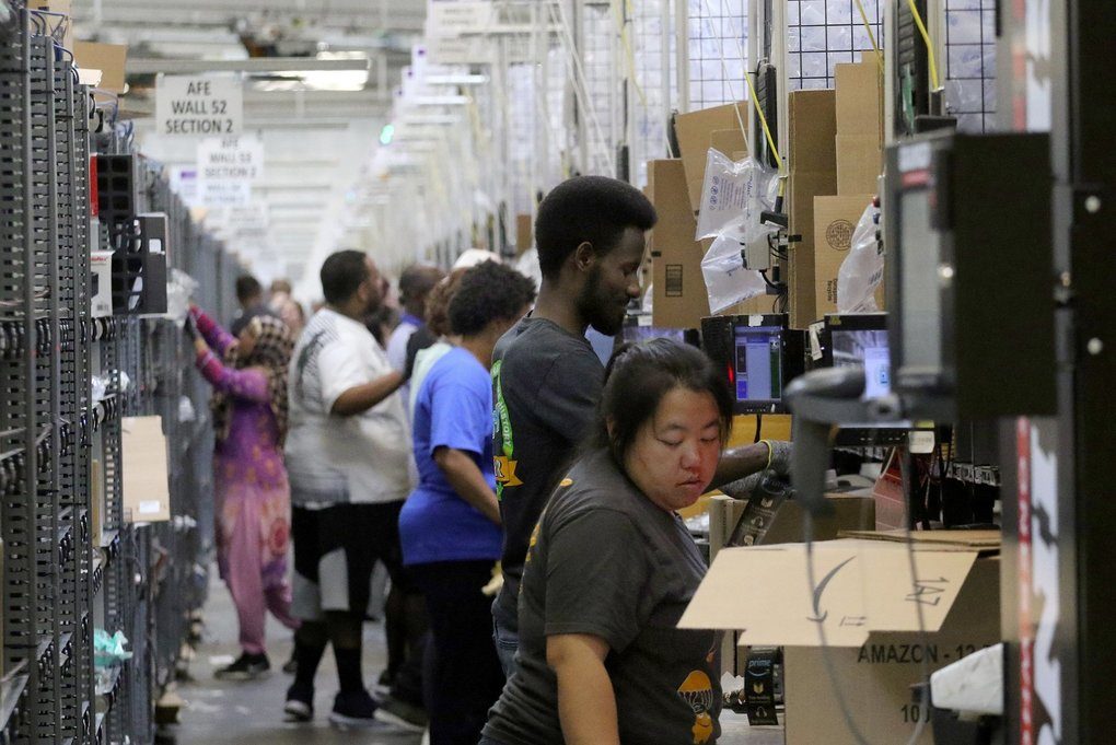 Click to enlarge Amazon packing workers