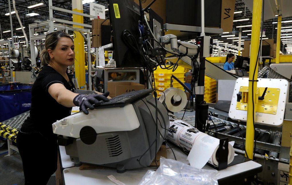 Click to enlarge Amazon Kent warehouse worker