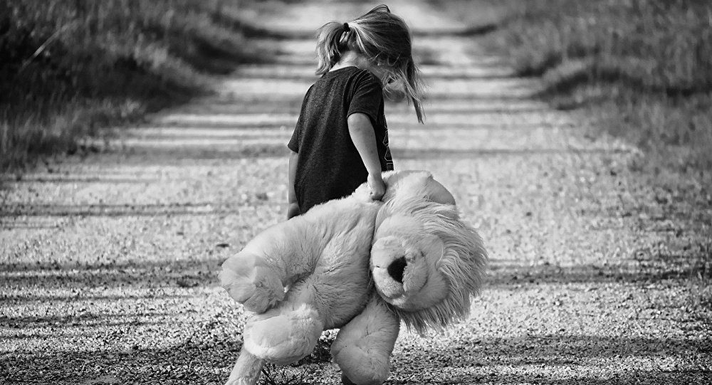 Click to enlarge Toddler with a toy