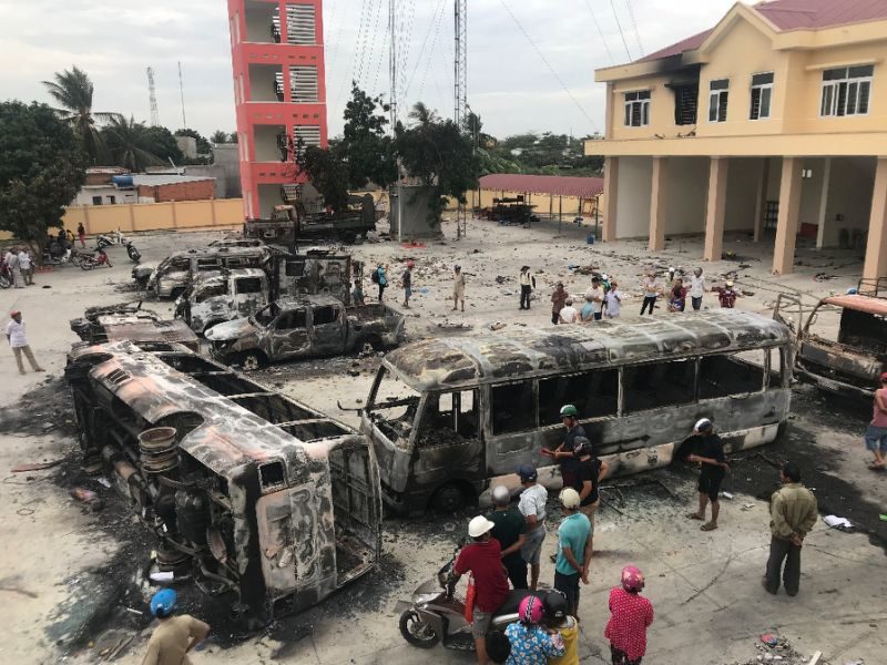 Charred buses at Vietnamese police station