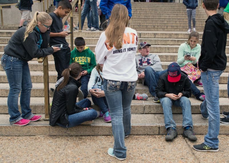 Click to enlarge teens on cellphones