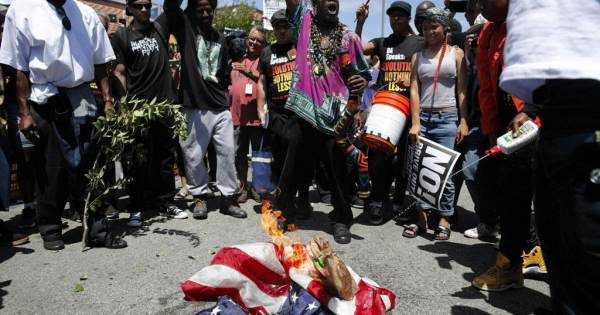 Click to enlarge Flag burning at Maxine Waters office
