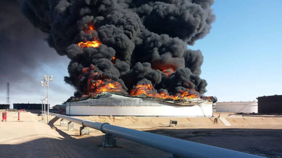 Smoke and flame rise from an oil storage tank that was set on fire amid fighting between rival factions at Ras Lanuf terminal, Libya  Reuters