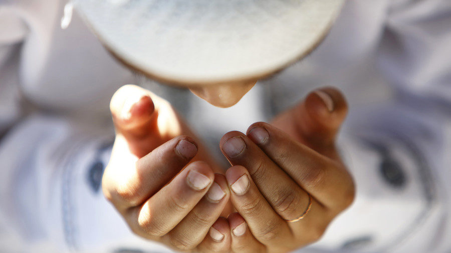 Muslim boy prays