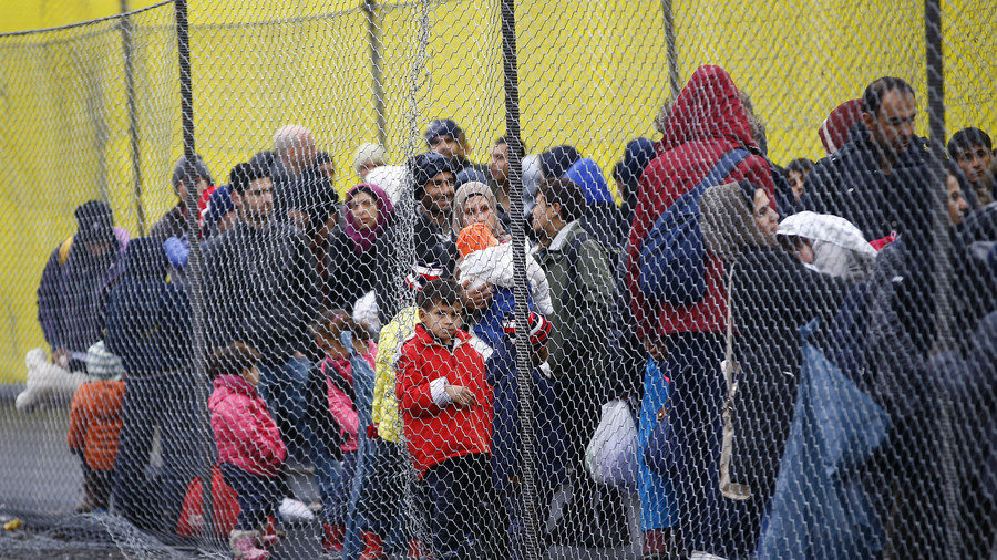 Migrants wait to cross the border from Slovenia into Spielfeld in Austria, February 16, 2016