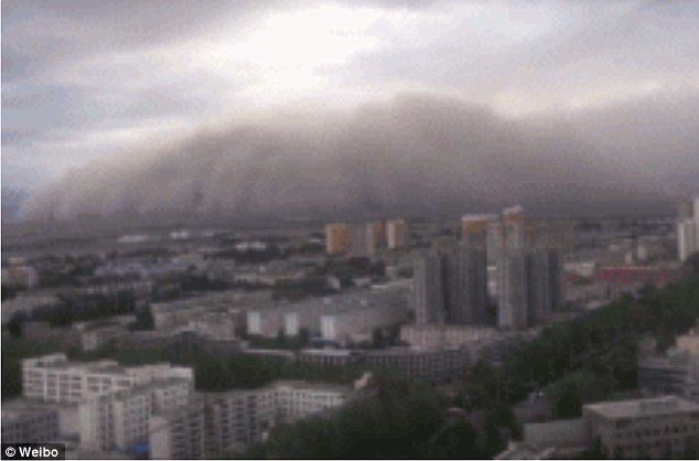 Apocalyptic scenes of dust cloud rolling over a city in north China are captured by residents