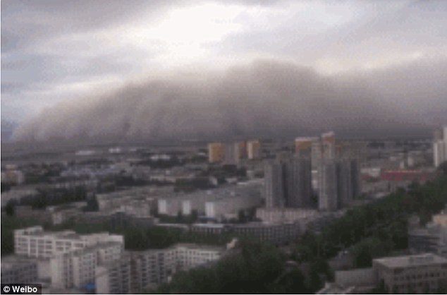 Click to enlarge Apocalyptic scenes of dust cloud rolling over a city in north China are captured by residents