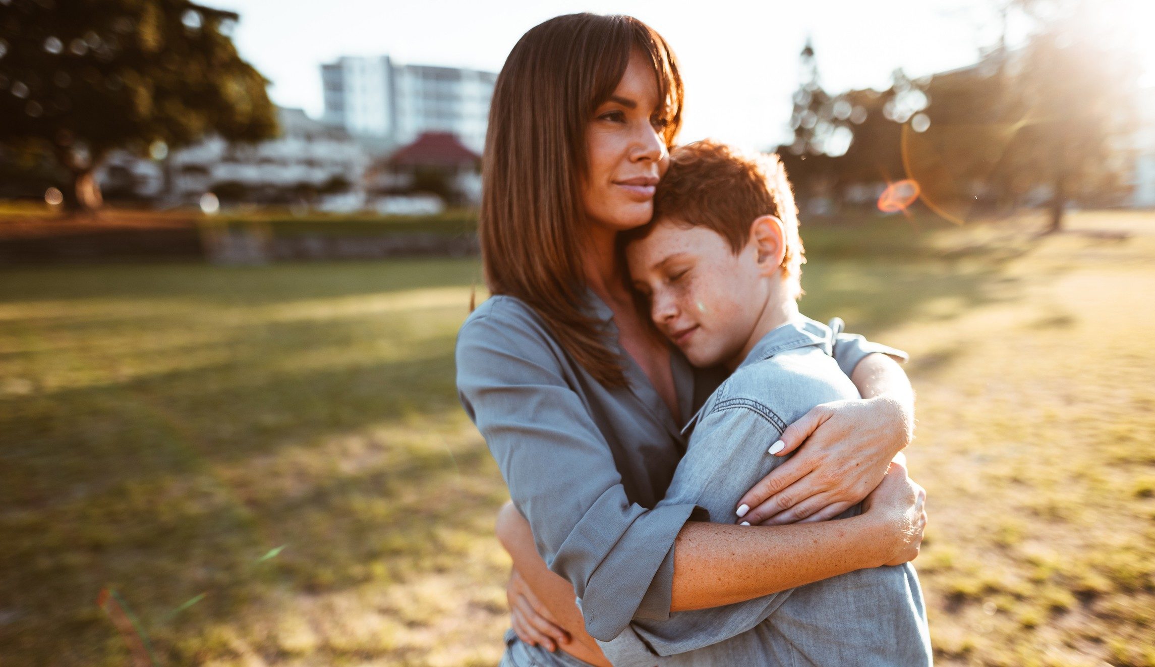 woman hugging child