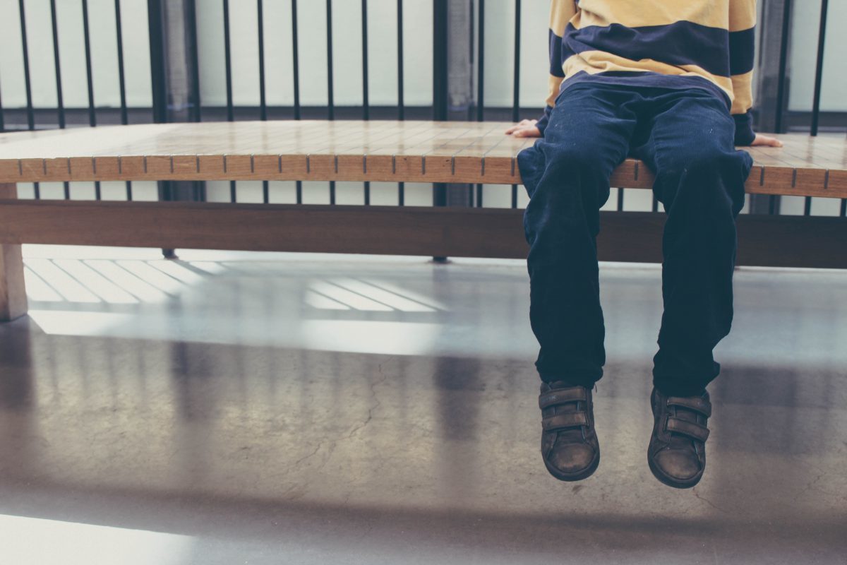 Click to enlarge kid sitting on bench
